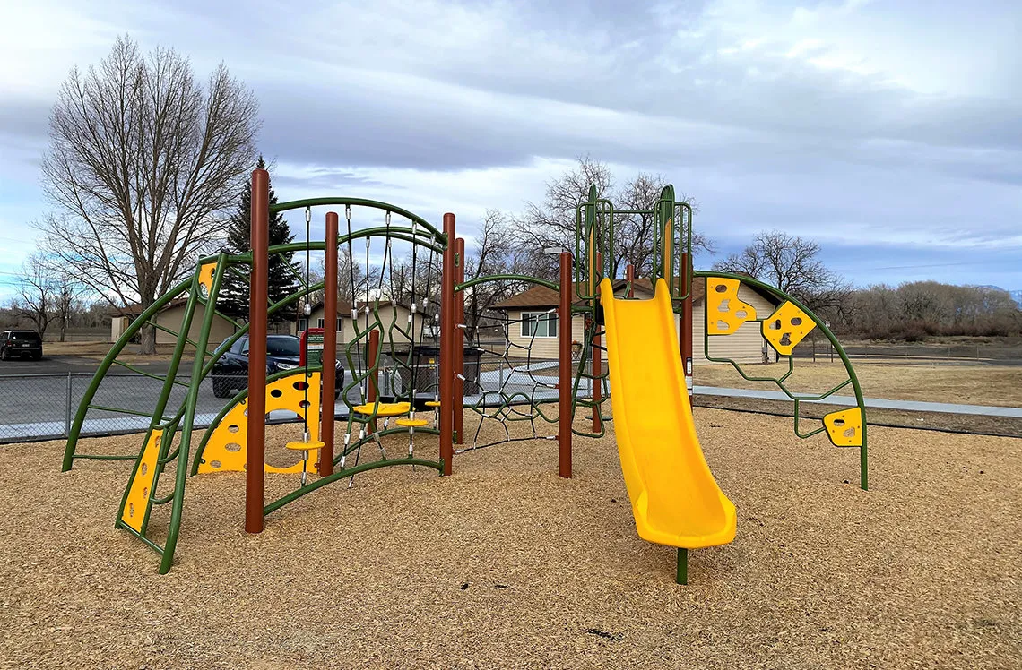 Slide with climbing structures at Alamosa Housing Authority